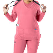 Dusty rose scrub top on a white background