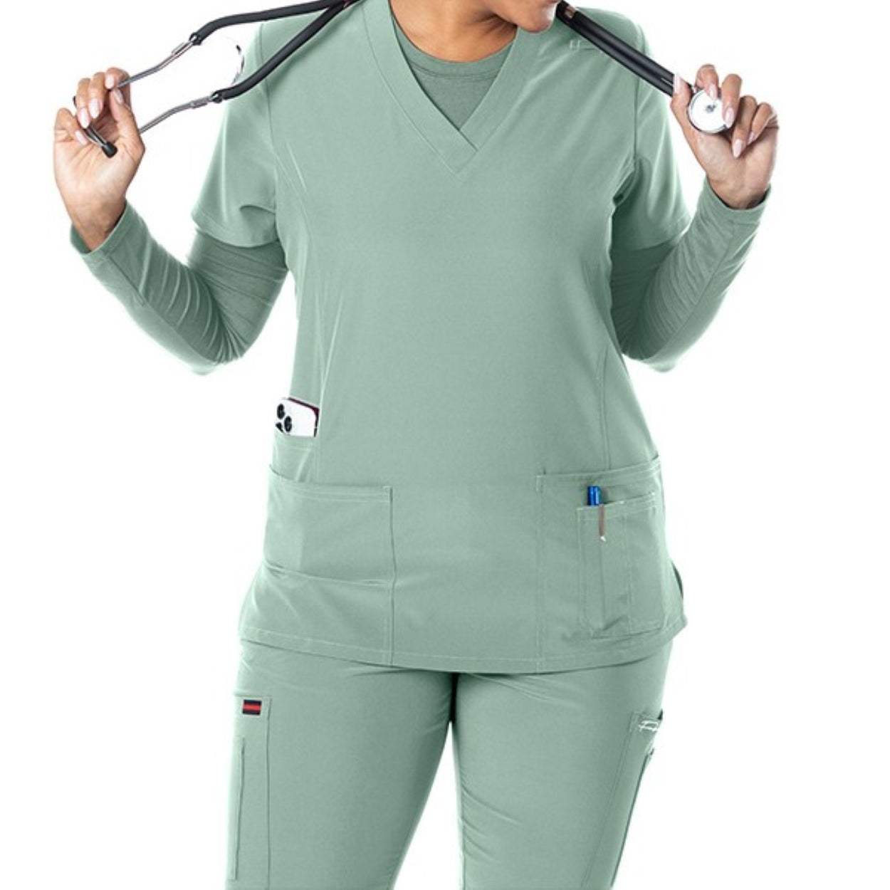 Misty green scrub top on a white background