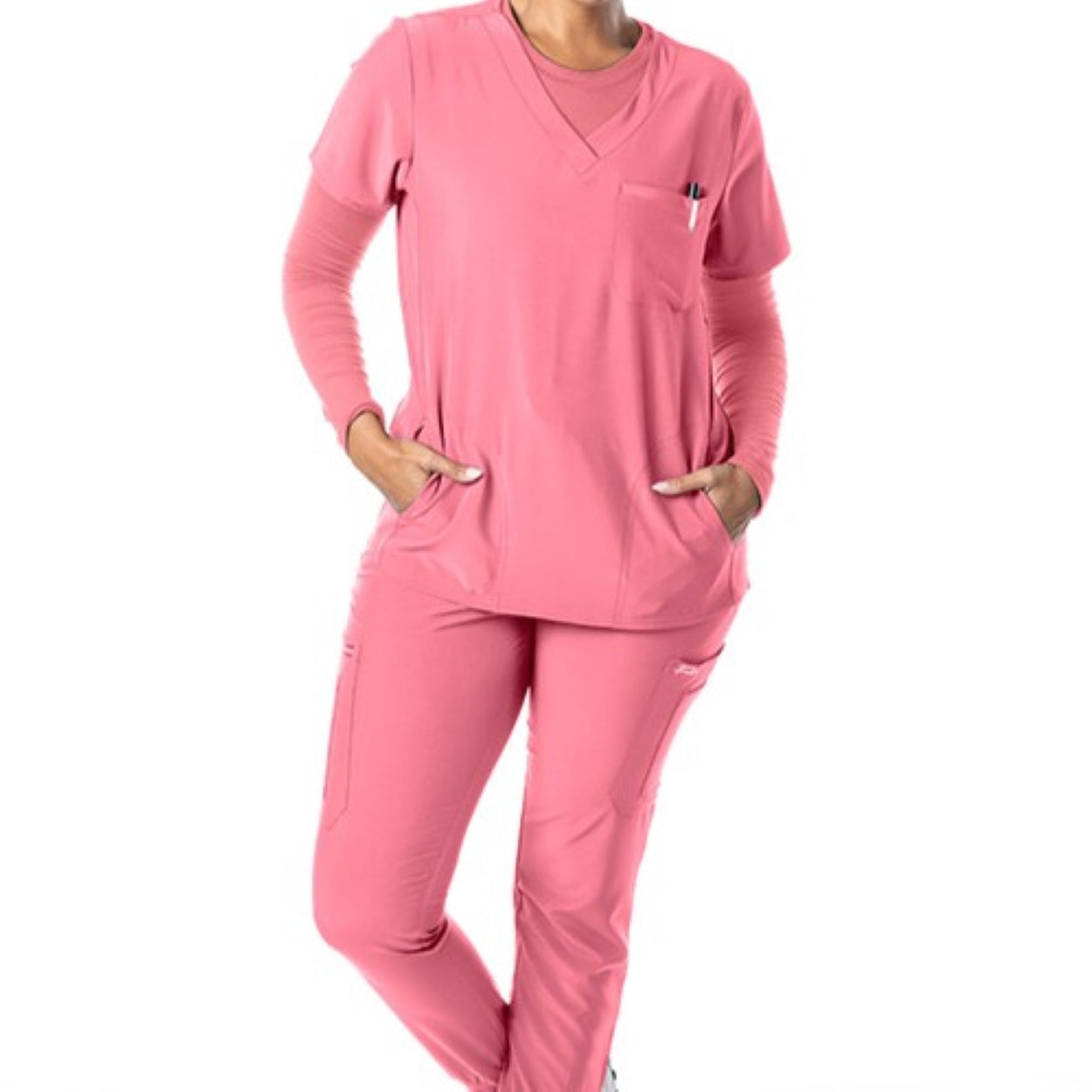 Dusty rose scrub top on a white background