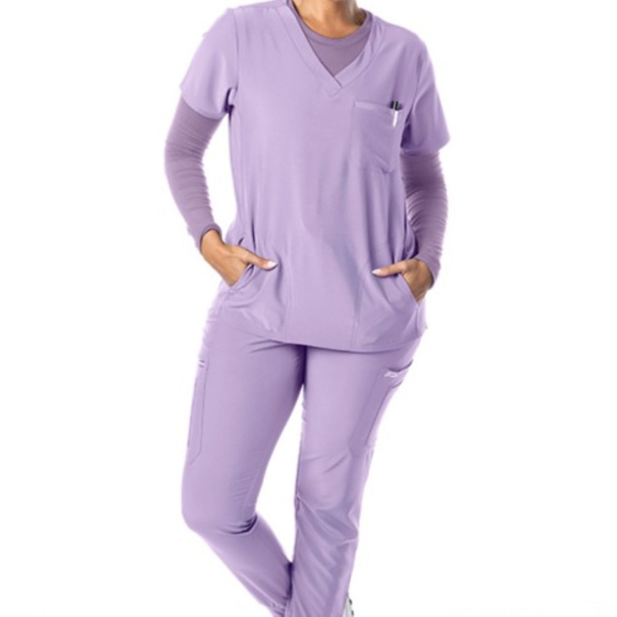 Lavender scrub top on a white background