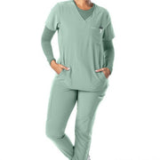 Misty green scrub top on a white background