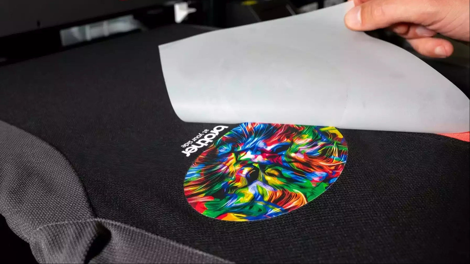 DTF print being pealed off on black polo
