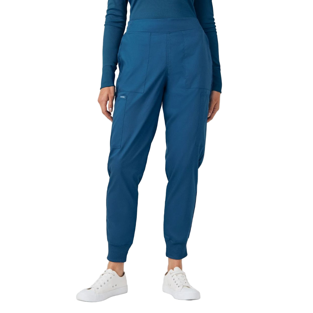 Caribbean blue scrub pants on a white background