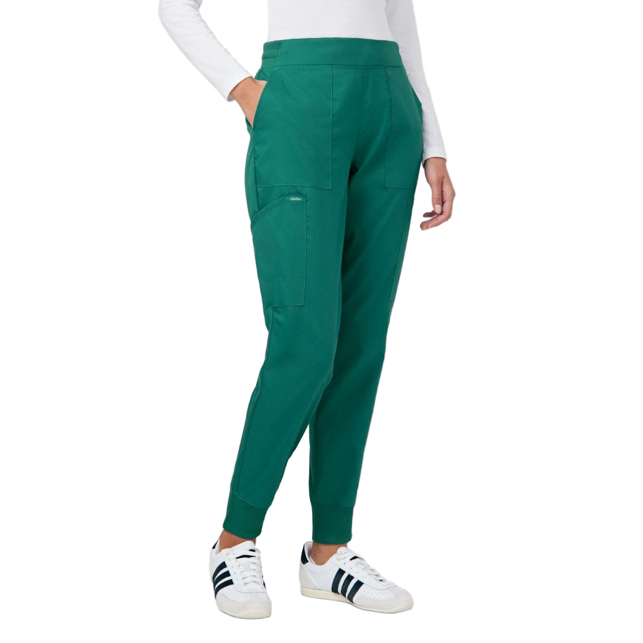 Hunter green scrub pants on a white background