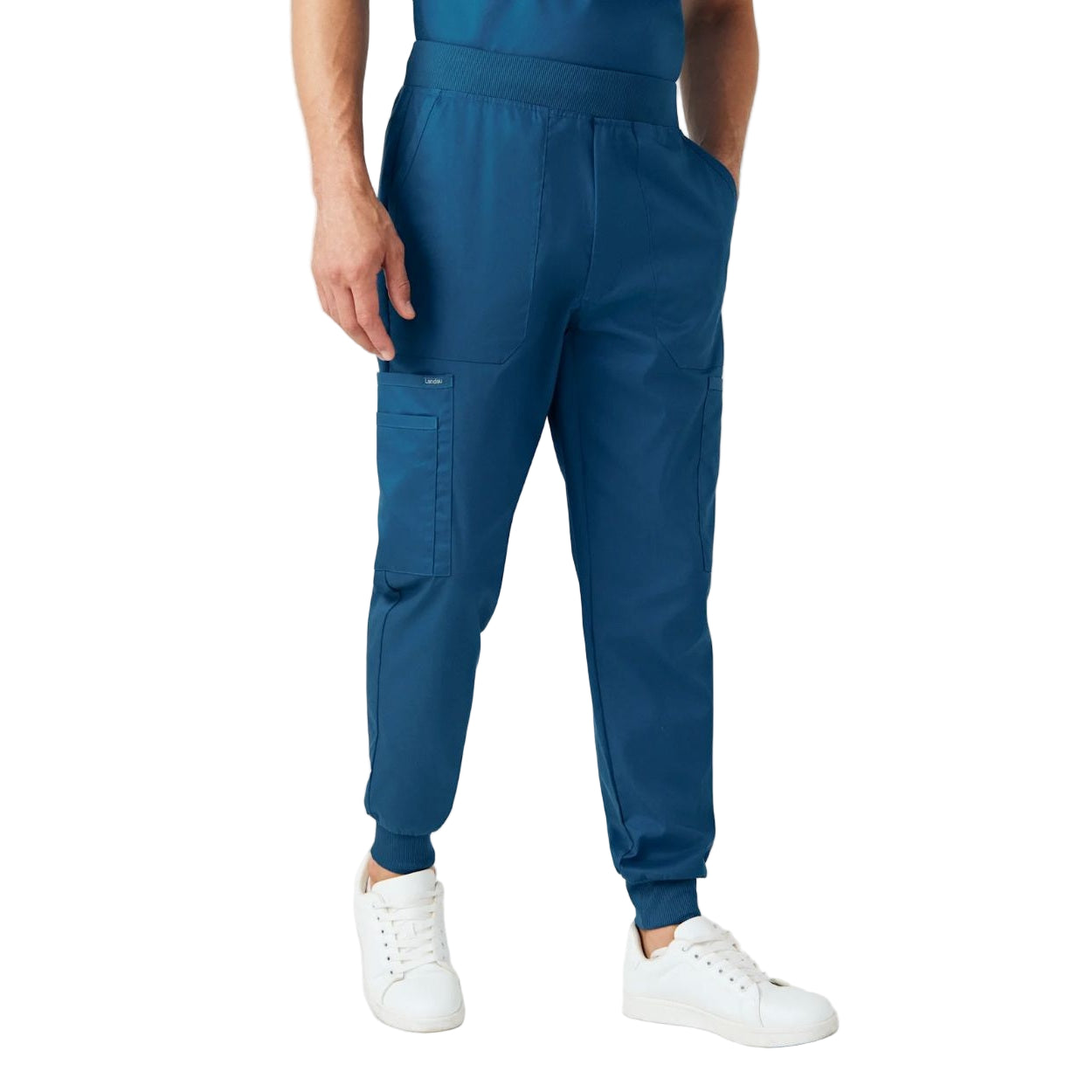 Caribbean blue scrub pants on a white background