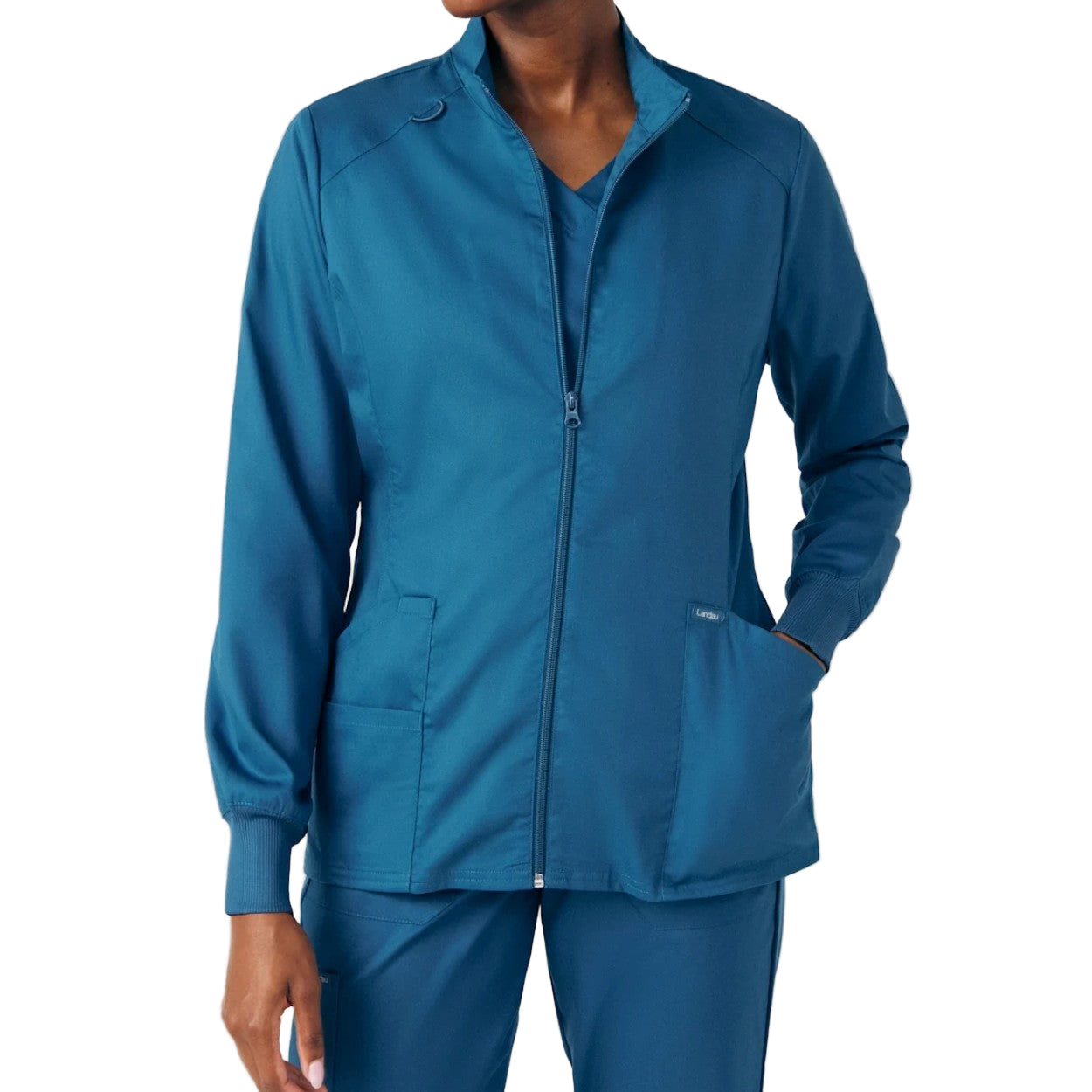 Caribbean blue scrub jacket on a white background