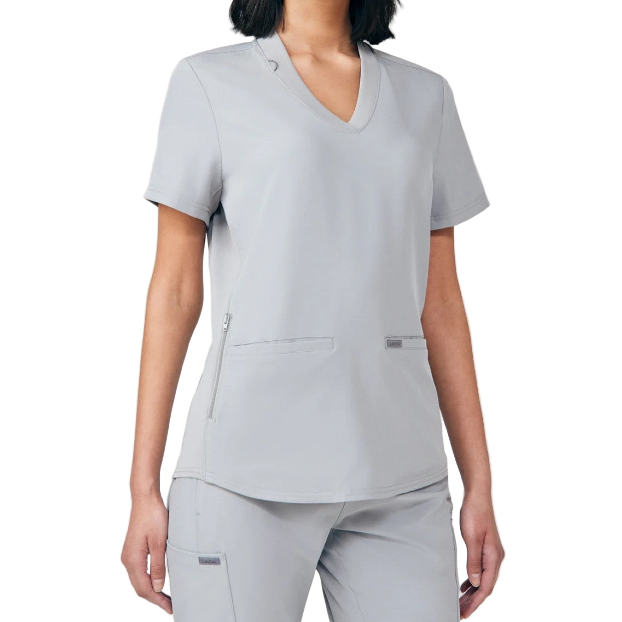 Grey scrub top on a white background