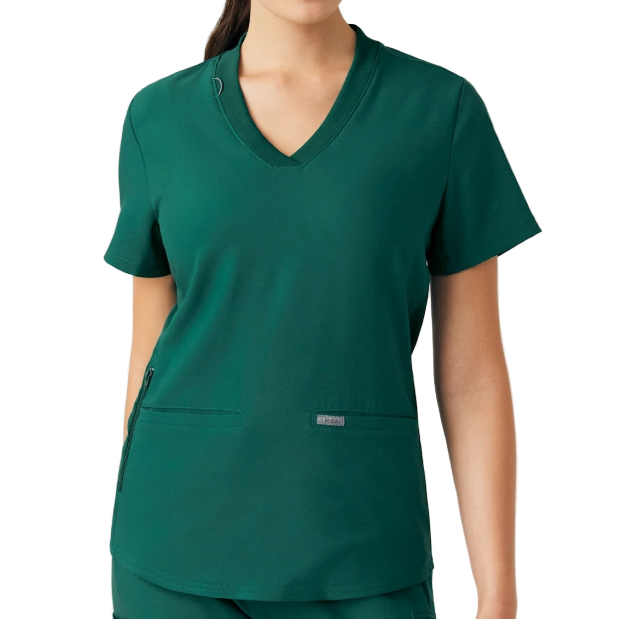 Hunter green scrub top on a white background