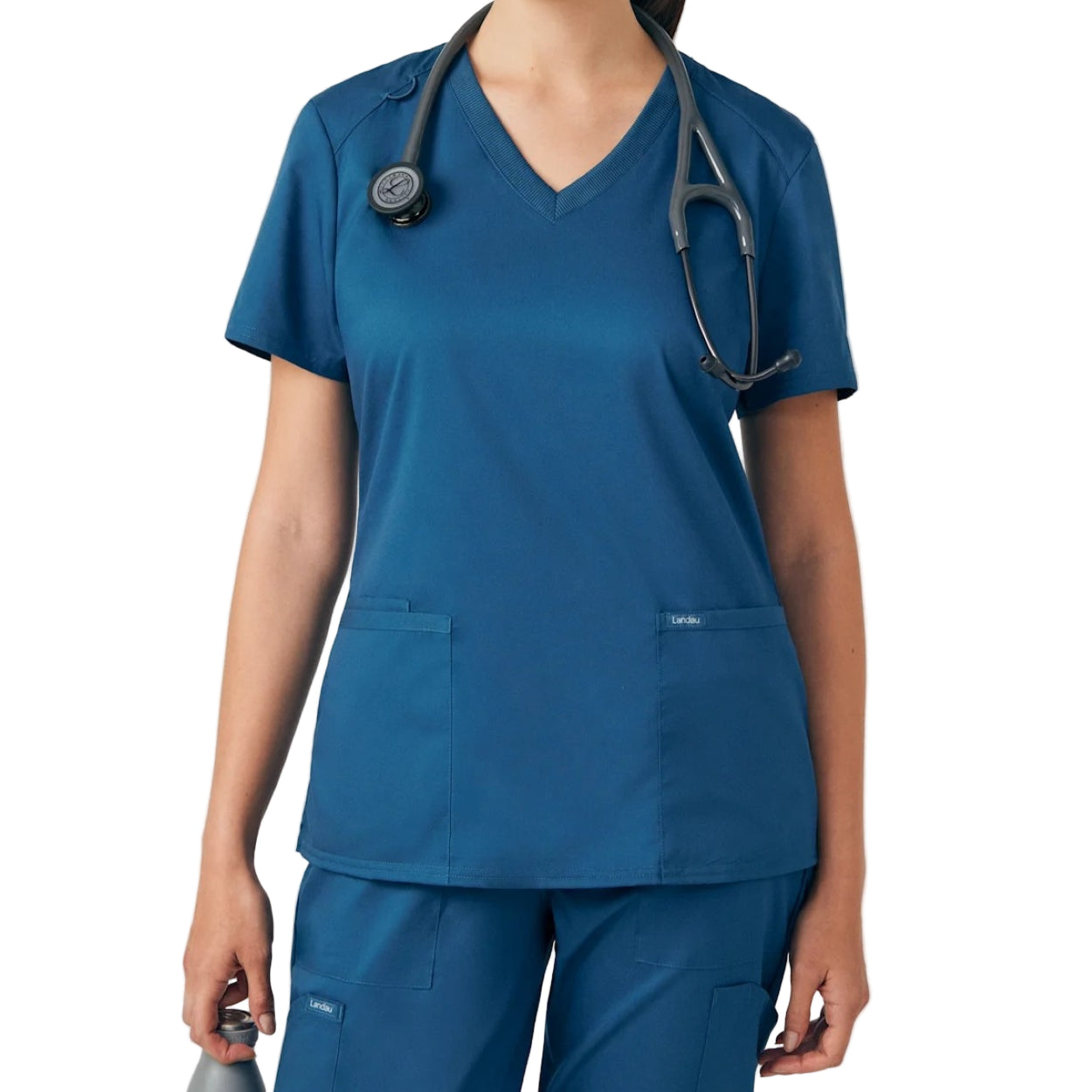 Caribbean blue scrub top on a white background