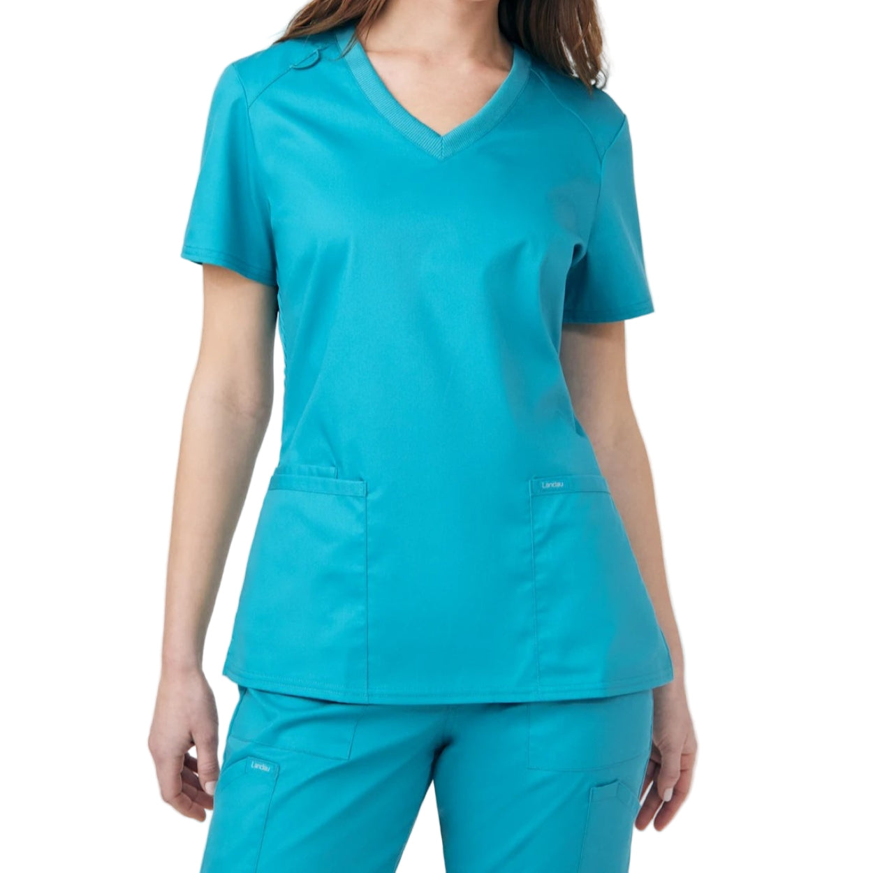 Teal scrub top on a white background