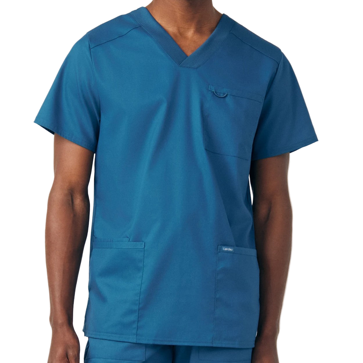 Caribbean blue scrub top on a white background