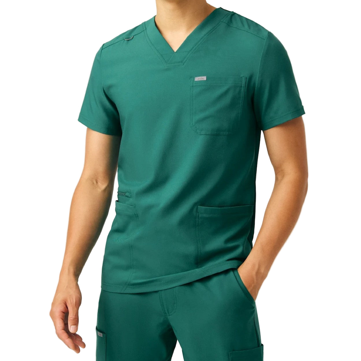 Hunter green scrub top on a white background