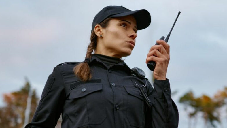 Female in security uniform working